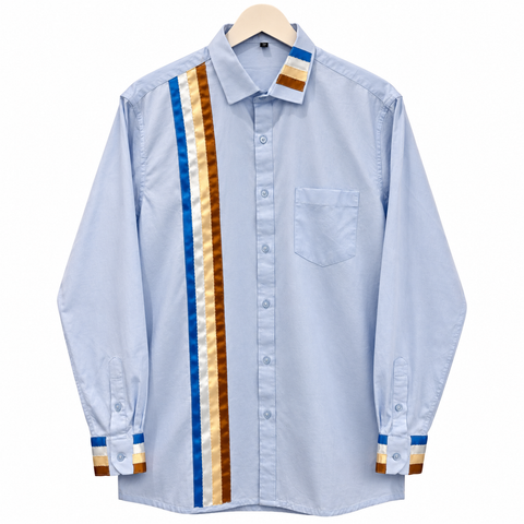 Light blue Cree ribbon shirt with blue and brown satin ribbon details, hand-sewn by Alexandria Coon of Mistissini, Eeyou Istchee.