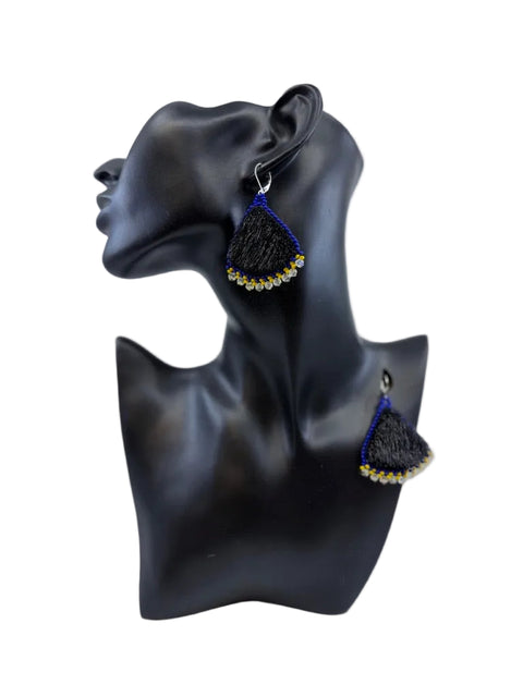 Black sealskin earrings with royal blue beadwork and yellow, white and silver bead accents by Elisapee Pootoogook