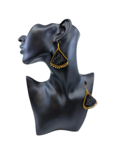 Black sealskin earrings with gold beadwork and yellow bead accents by Elisapee Pootoogook
