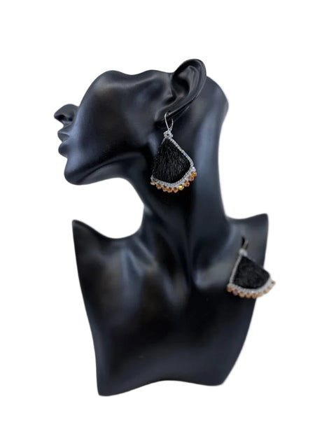 Black sealskin earrings with silver beadwork and amber bead accents by Elisapee Pootoogook
