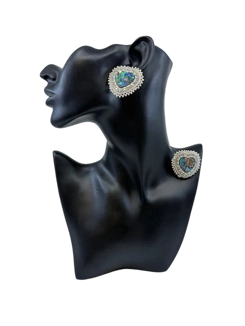 Beaded moosehide abalone shell heart earrings by Ironstar Co shown on display