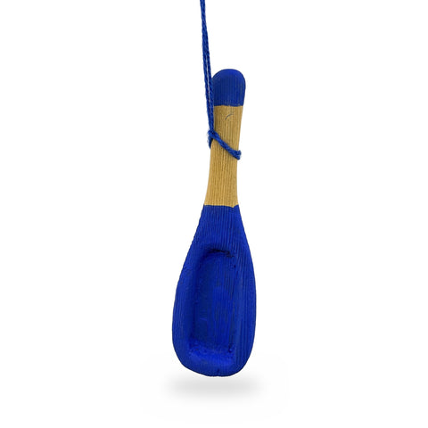 Blue-painted wood mini snow shovel ornament with a hollowed blade and natural wood handle, hanging from a blue string