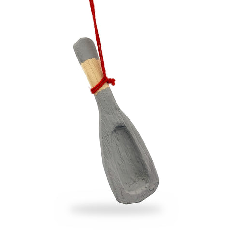 Grey-painted wood mini snow shovel ornament with a hollowed blade and natural wood handle, hanging from a red string
