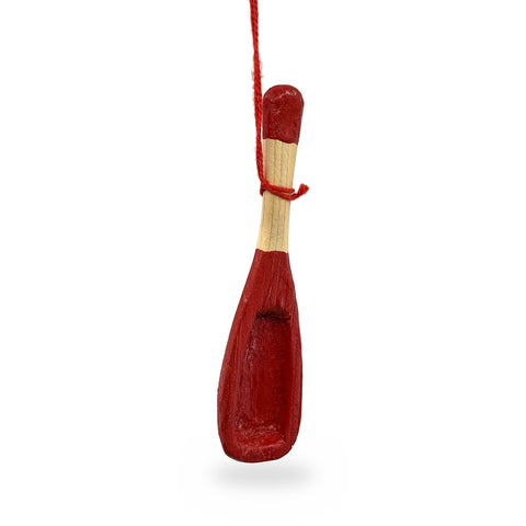 Red-painted wood mini snow shovel ornament with a hollowed blade and natural wood handle, hanging from a red string