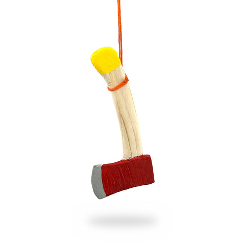 Natural wood mini axe ornament with a red-painted head and yellow handle end, hanging from an orange string, by Gordon H. Blackned